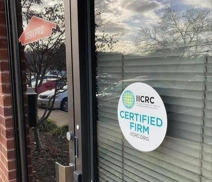 IICRC Certification sticker on front door of an office.